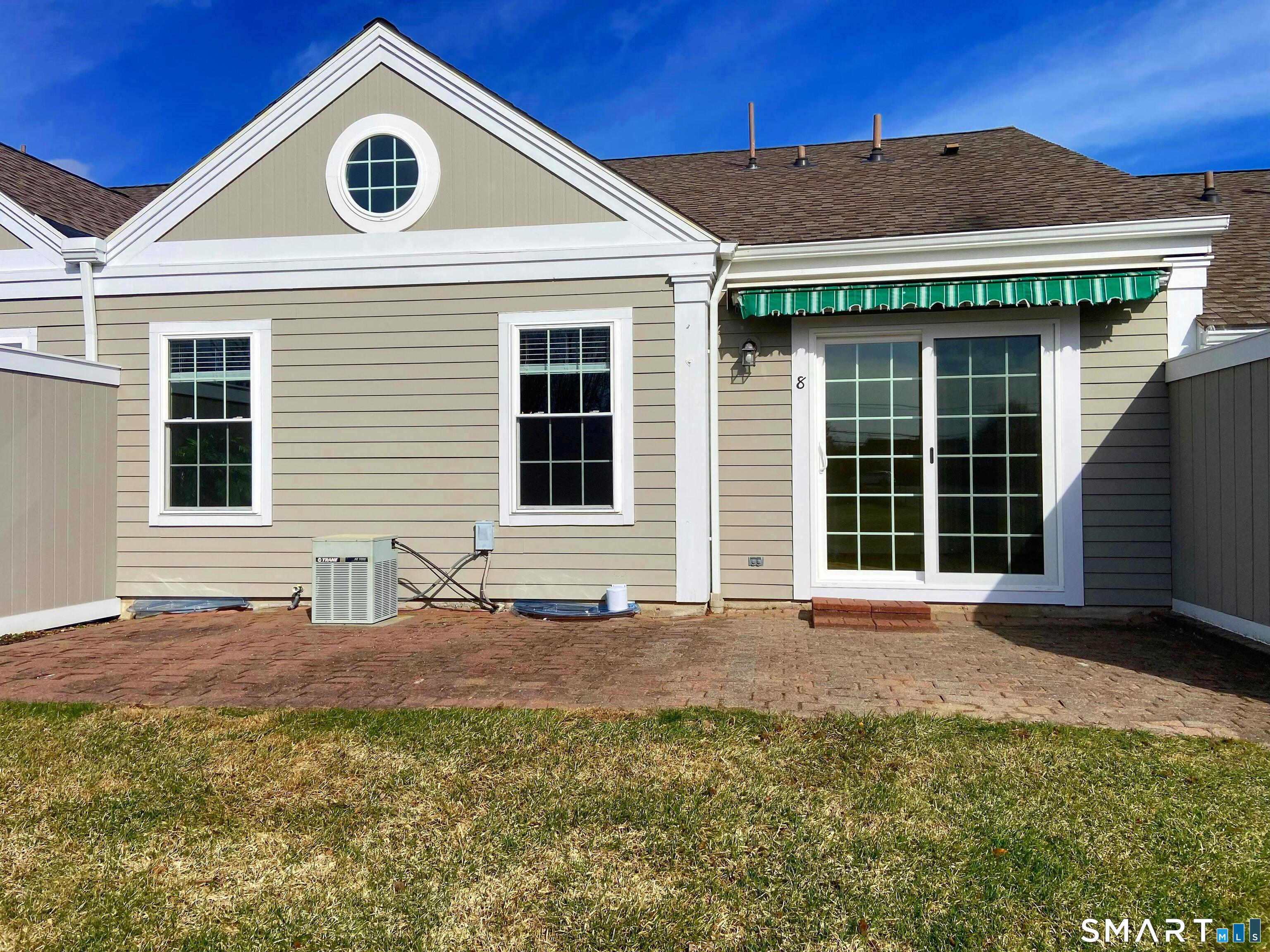 8 St George Place, Unit 8 Newtown, CT 06482 - Photo 21 of 31 a front view of a house with a yard