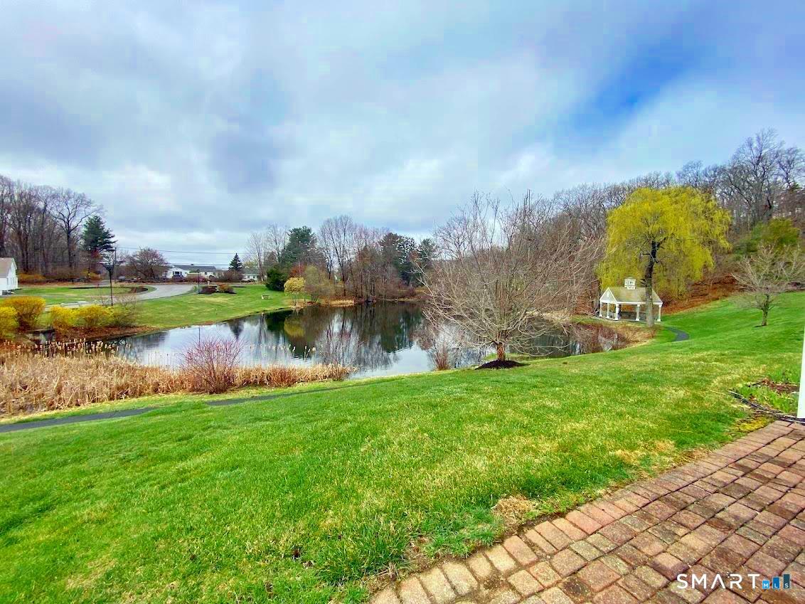 8 St George Place, Unit 8 Newtown, CT 06482 - Photo 22 of 31 Nice elevated view of the fountain pond from the patio