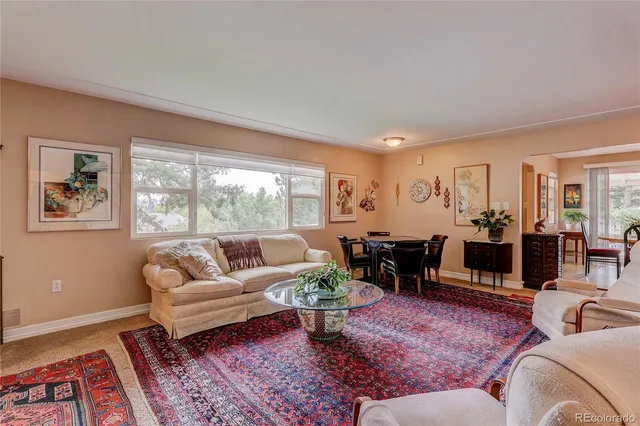 a living room with furniture and a rug