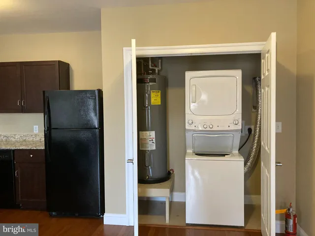 a kitchen with a refrigerator and washer
