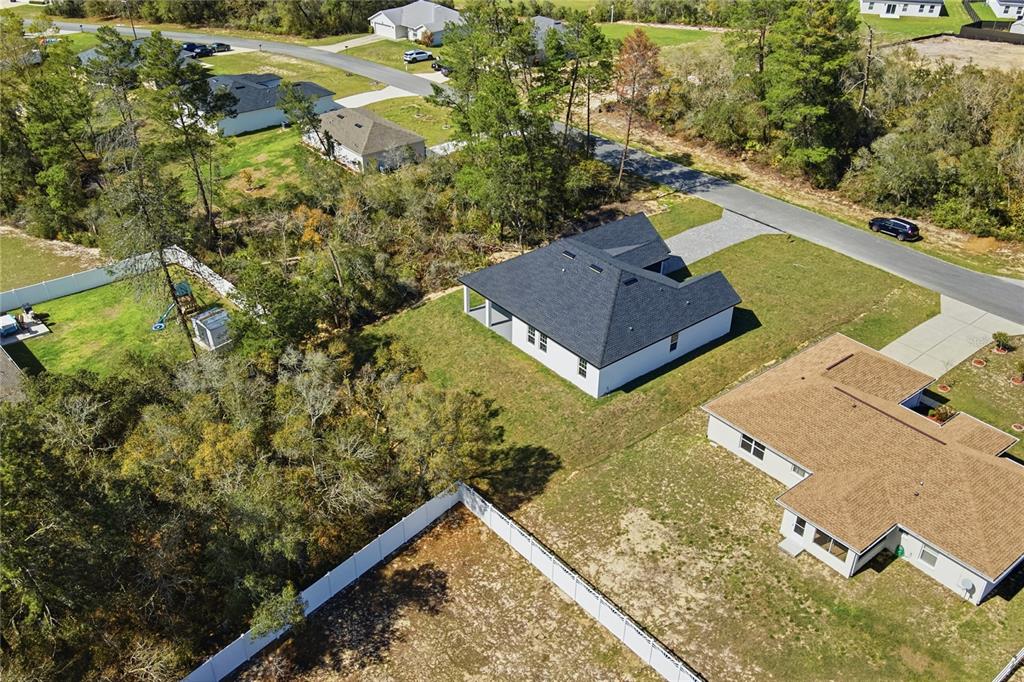 2600 Southwest 146th Pl Road Ocala, FL 34473 - Photo 31 of 40 an aerial view of a house with a yard