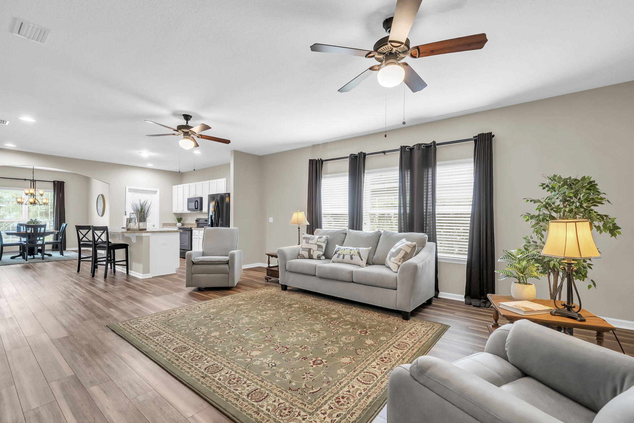 115 Lilly Bell Lane Freeport, FL 32439 - Photo 20 of 47 a living room with furniture and a large window