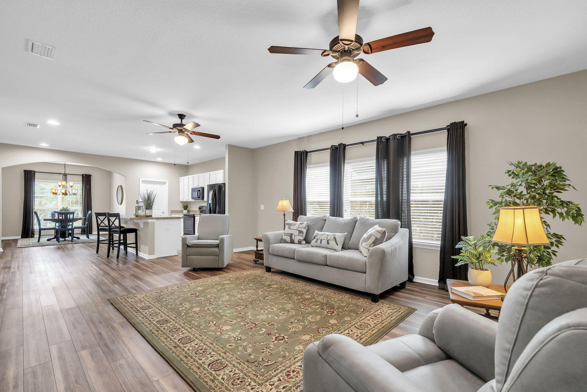 115 Lilly Bell Lane Freeport, FL 32439 - Photo 21 of 47 a living room with furniture and a large window