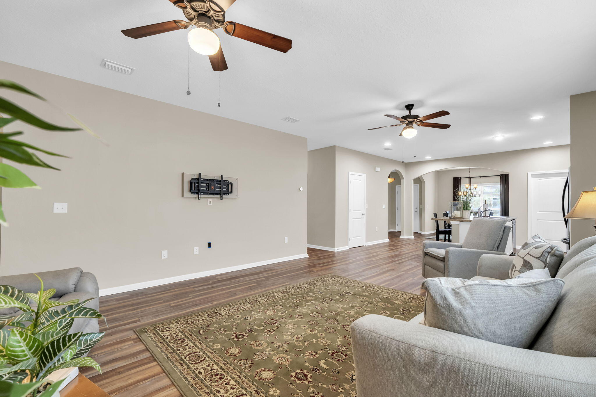 115 Lilly Bell Lane Freeport, FL 32439 - Photo 22 of 47 a living room with furniture and a chandelier