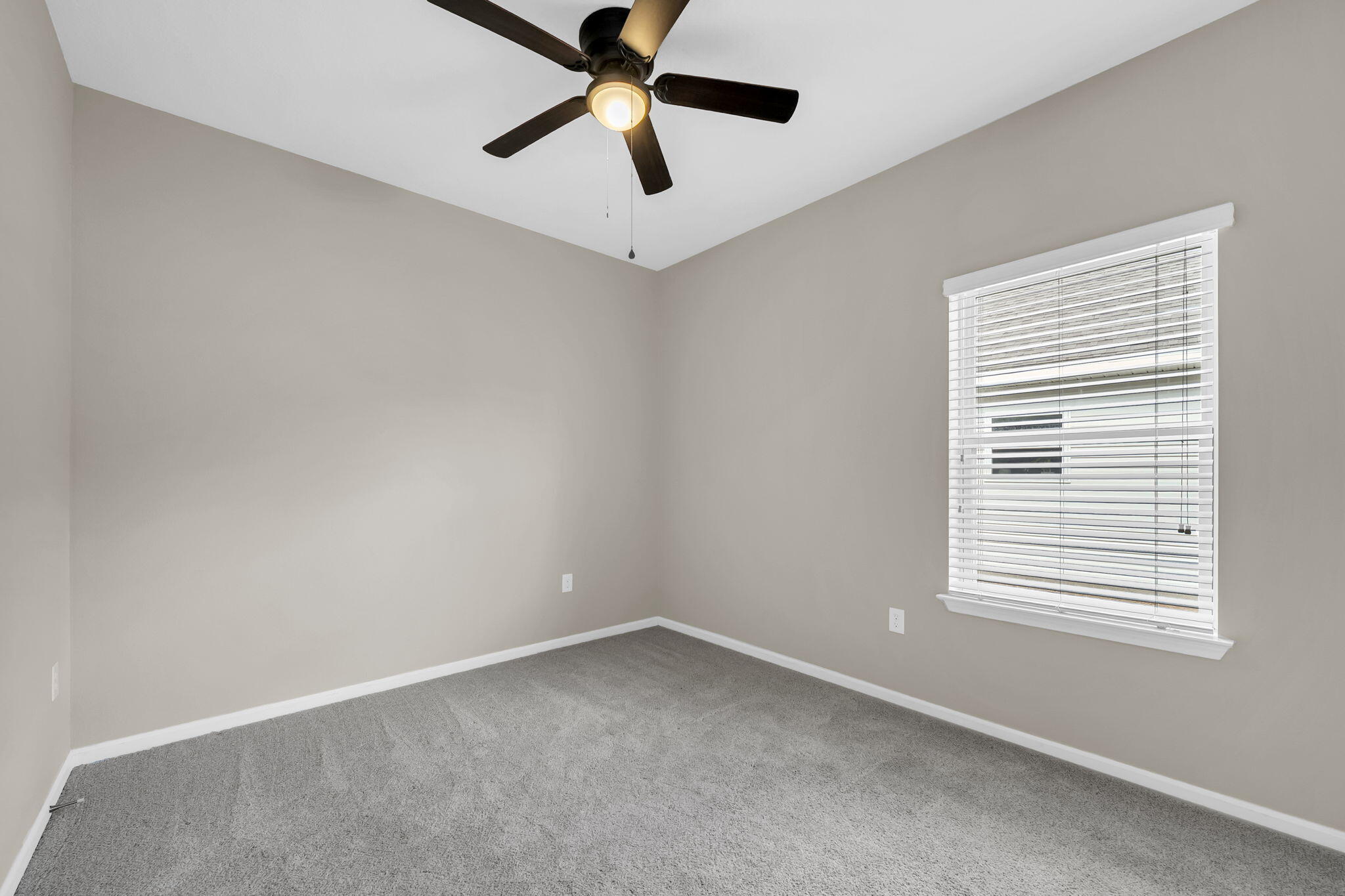 115 Lilly Bell Lane Freeport, FL 32439 - Photo 24 of 47 an empty room with a window and a ceiling fan