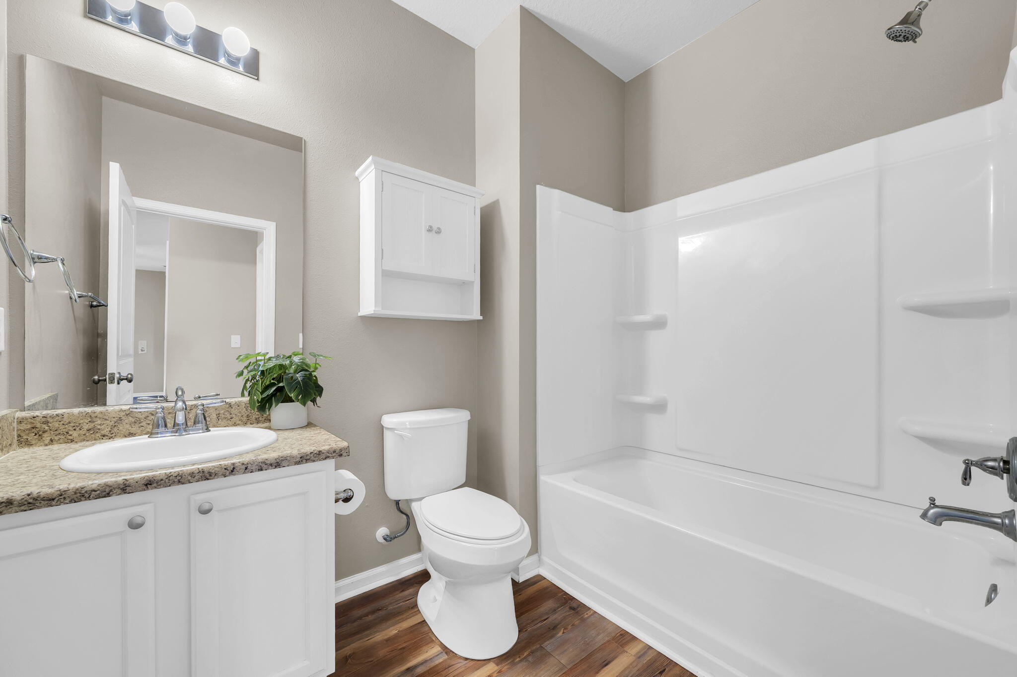 115 Lilly Bell Lane Freeport, FL 32439 - Photo 26 of 47 a bathroom with a granite countertop sink toilet and shower
