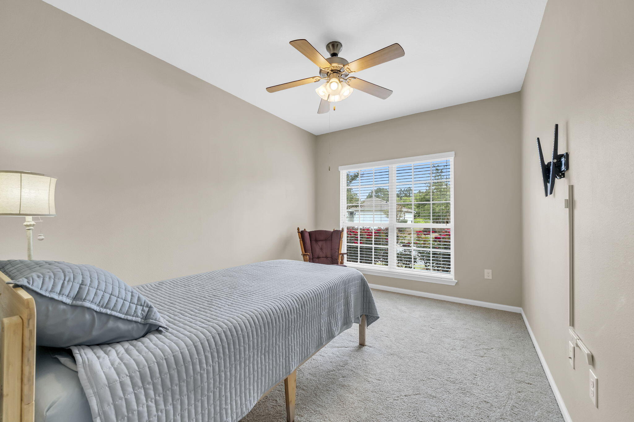 115 Lilly Bell Lane Freeport, FL 32439 - Photo 27 of 47 a bedroom with a large bed and a window