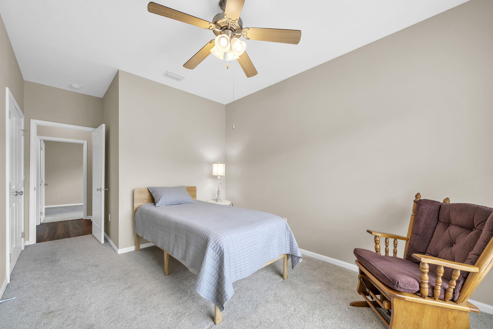 115 Lilly Bell Lane Freeport, FL 32439 - Photo 28 of 47 a bedroom with a bed and a couch