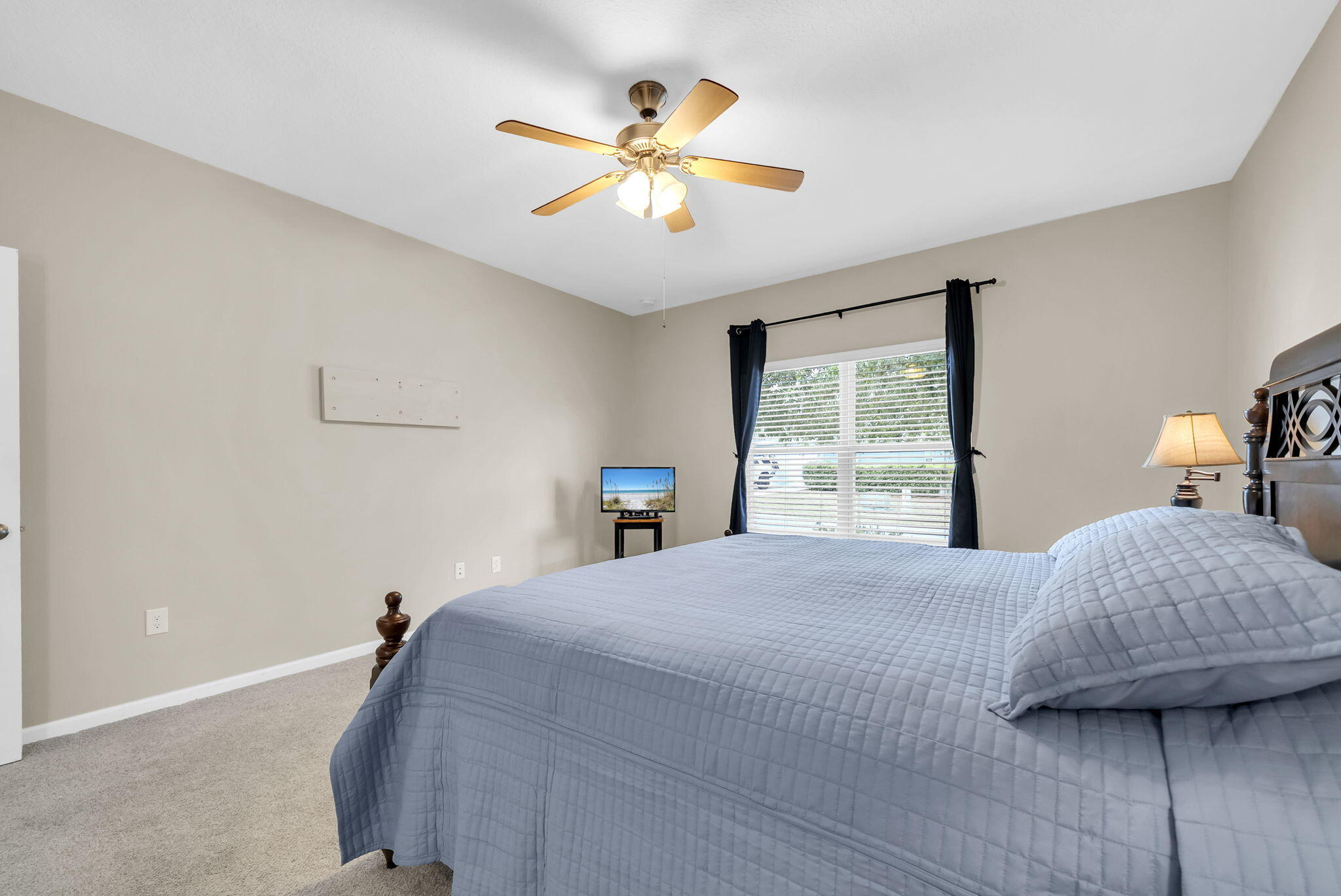 115 Lilly Bell Lane Freeport, FL 32439 - Photo 30 of 47 a bedroom with a bed and window