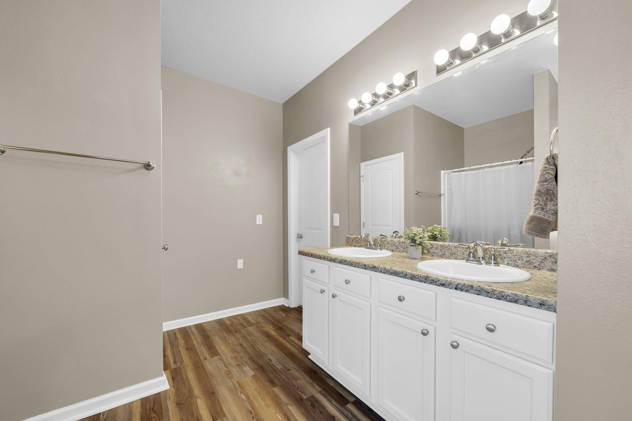 115 Lilly Bell Lane Freeport, FL 32439 - Photo 32 of 47 a bathroom with a double vanity sink and a mirror