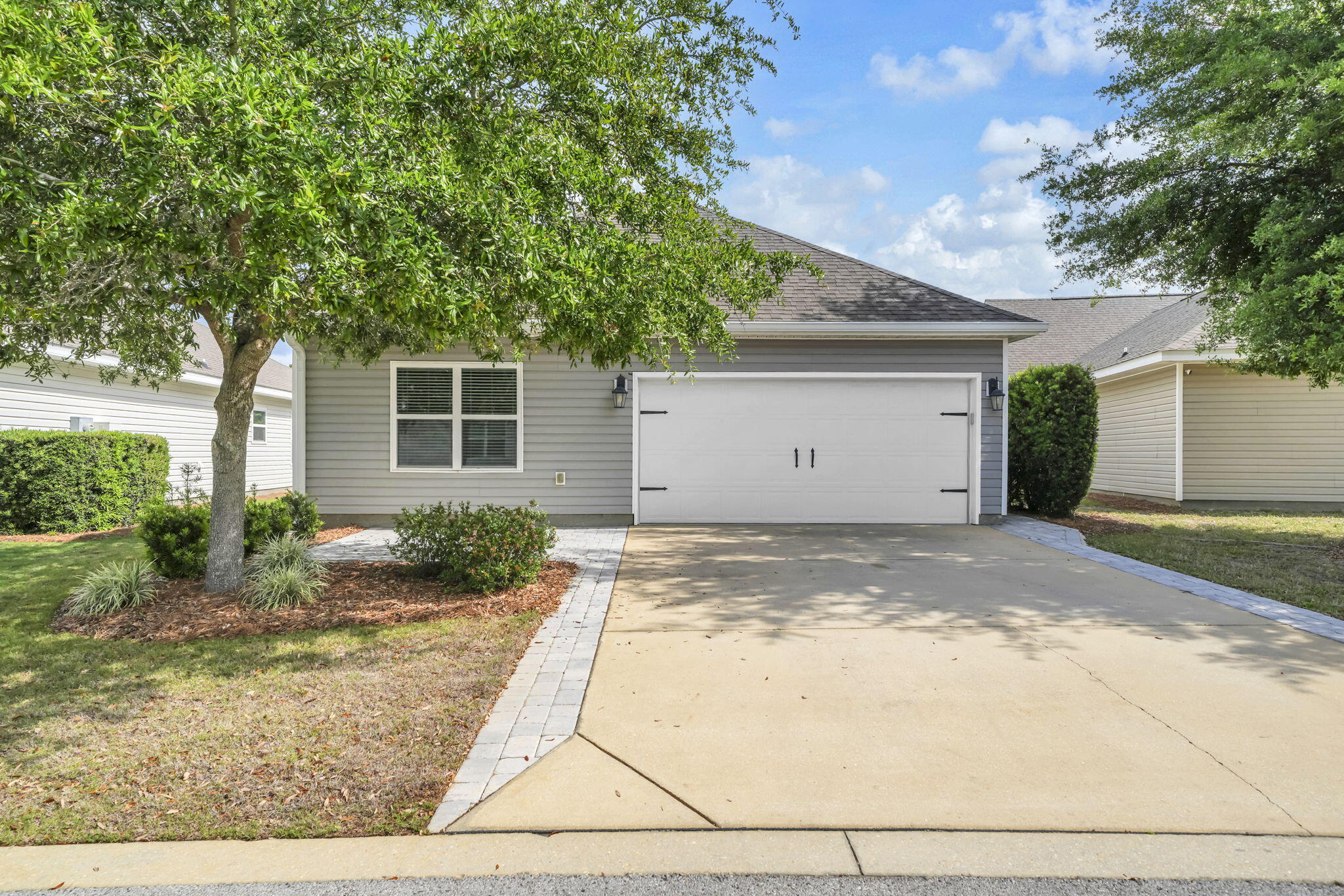 115 Lilly Bell Lane Freeport, FL 32439 - Photo 40 of 47 a view of a house with a yard and garage