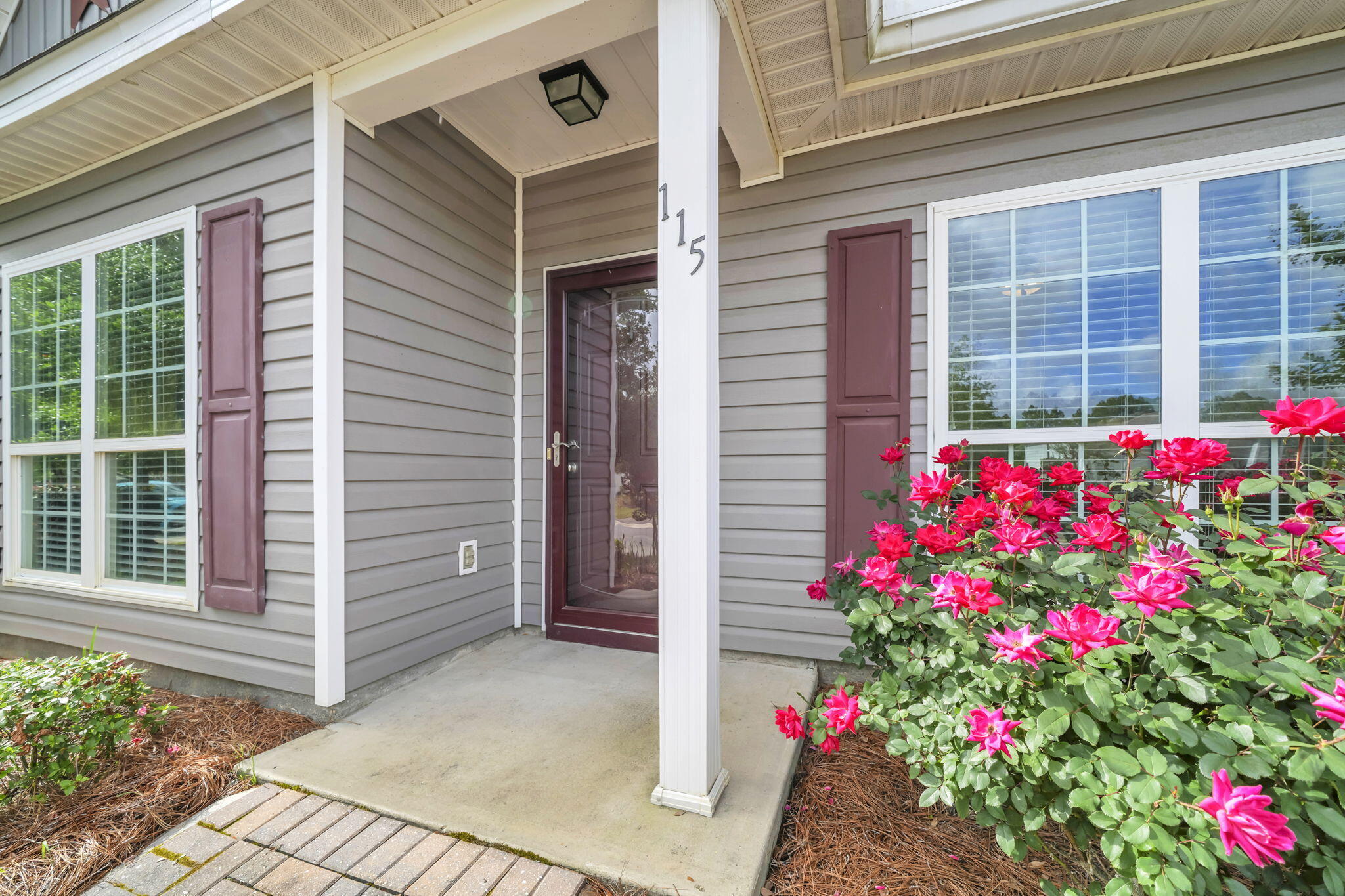 115 Lilly Bell Lane Freeport, FL 32439 - Photo 8 of 47 a view of a house with a potted plant