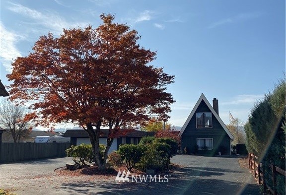 7419 Willow Grove Road Longview, WA 98632 - Photo 1 of 24 a view of a house with a tree next to a yard