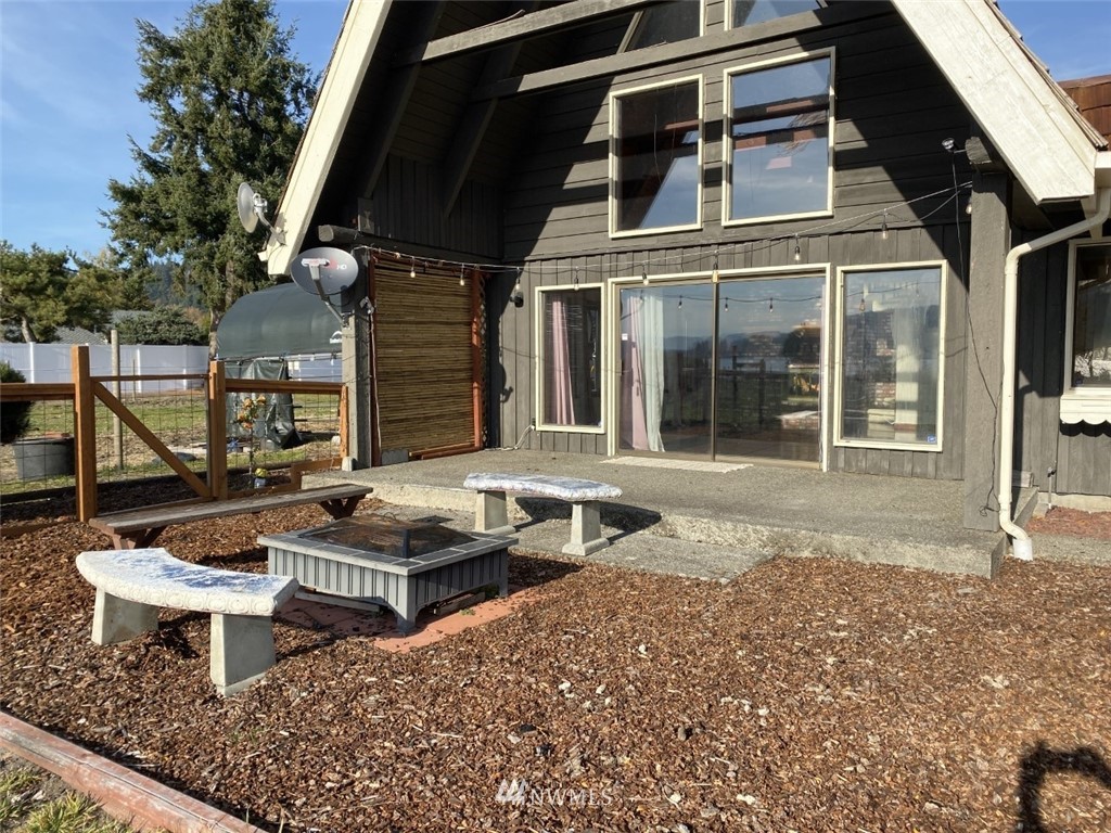 7419 Willow Grove Road Longview, WA 98632 - Photo 23 of 24 a front view of a house with balcony and patio