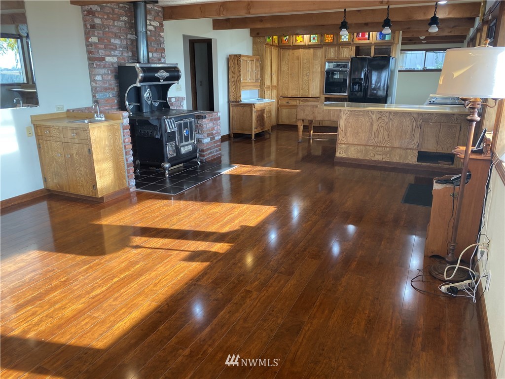 7419 Willow Grove Road Longview, WA 98632 - Photo 10 of 24 a view of kitchen and dining room with wooden floor