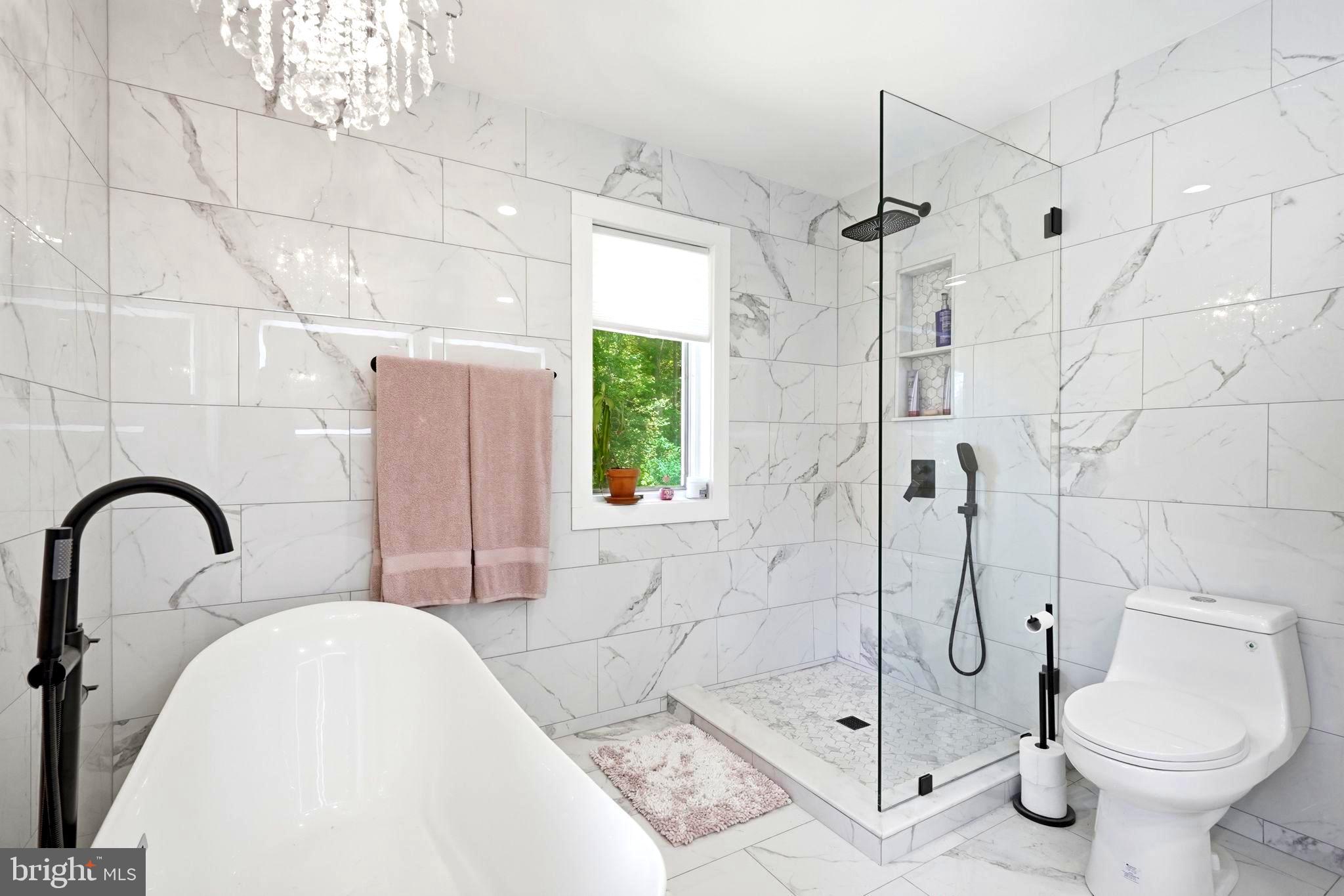 750 Levelgreen Road Lancaster, VA 22503 - Photo 46 of 107 Primary Bathroom with shower & elegant chandelier!