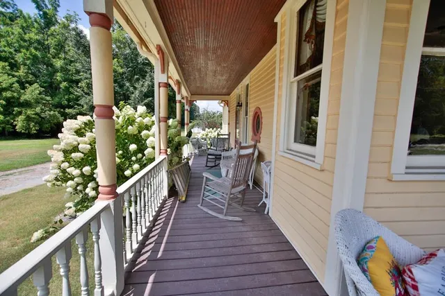 a view of balcony with wooden floor