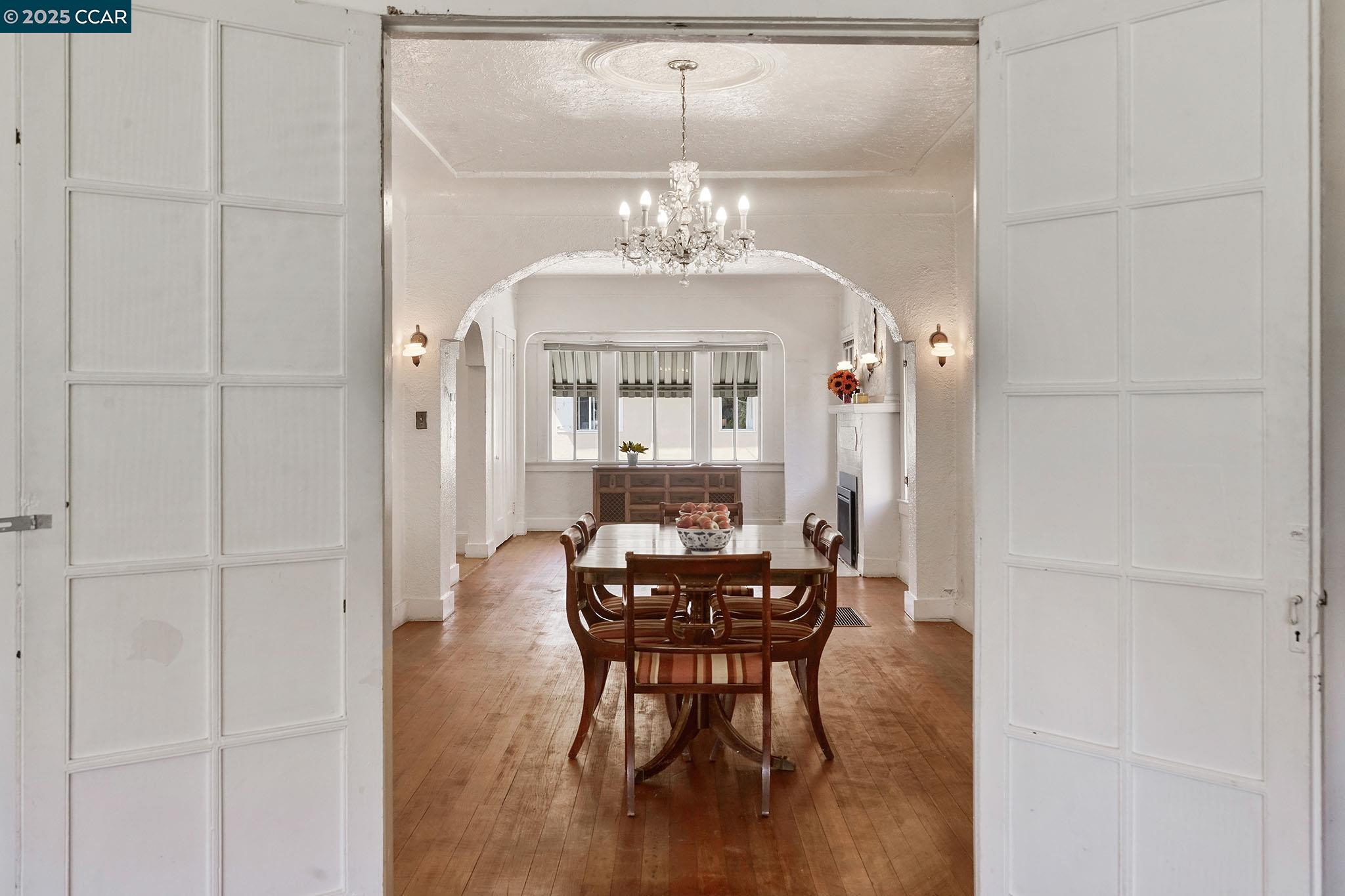1322 Virginia Street Berkeley, CA 94702 - Photo 22 of 54 a view of a dining room with furniture window and wooden floor
