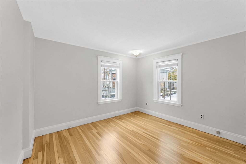 21-23 Richards Road, Unit 21 Watertown, MA 02472 - Photo 15 of 28 a view of empty room with wooden floor and fan