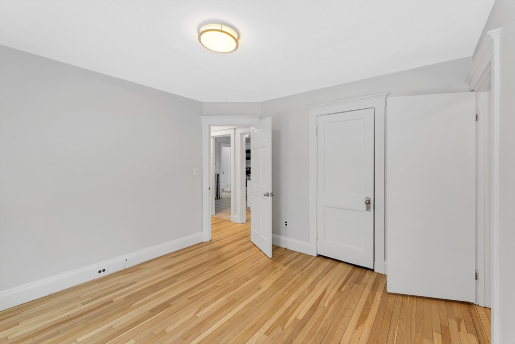 21-23 Richards Road, Unit 21 Watertown, MA 02472 - Photo 21 of 28 a view of wooden floor and windows in a room