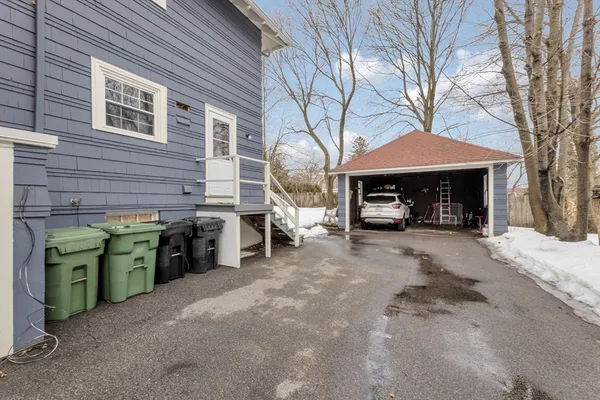 a view of a house with a snow in the yard