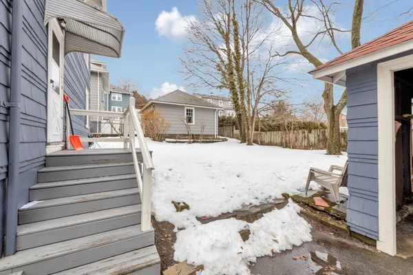 a view of a house with a snow in the yard