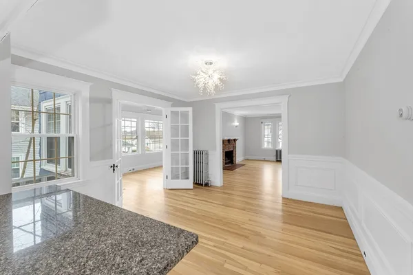 wooden floor in an empty room with a fireplace