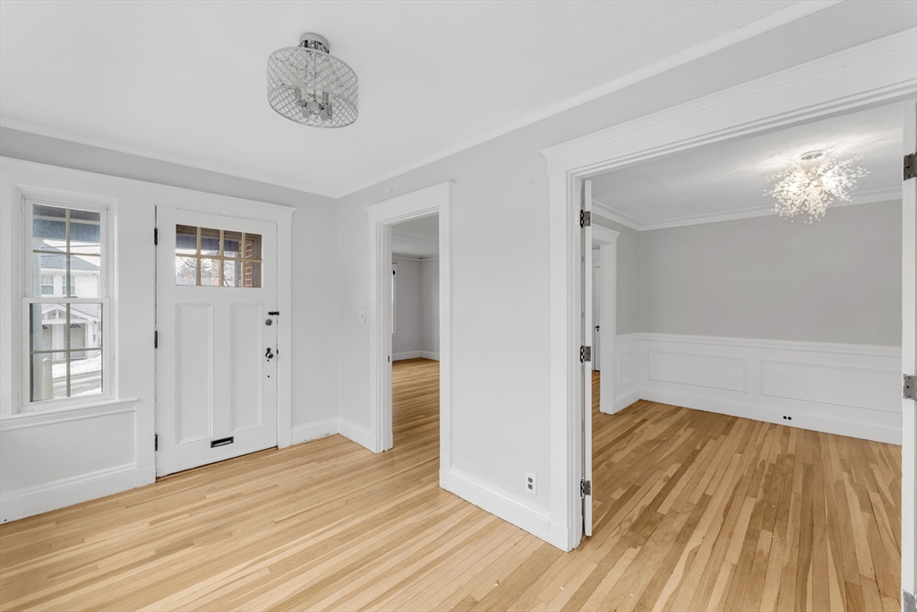 21-23 Richards Road, Unit 21 Watertown, MA 02472 - Photo 5 of 28 a view of a room with wooden floor and a bathroom