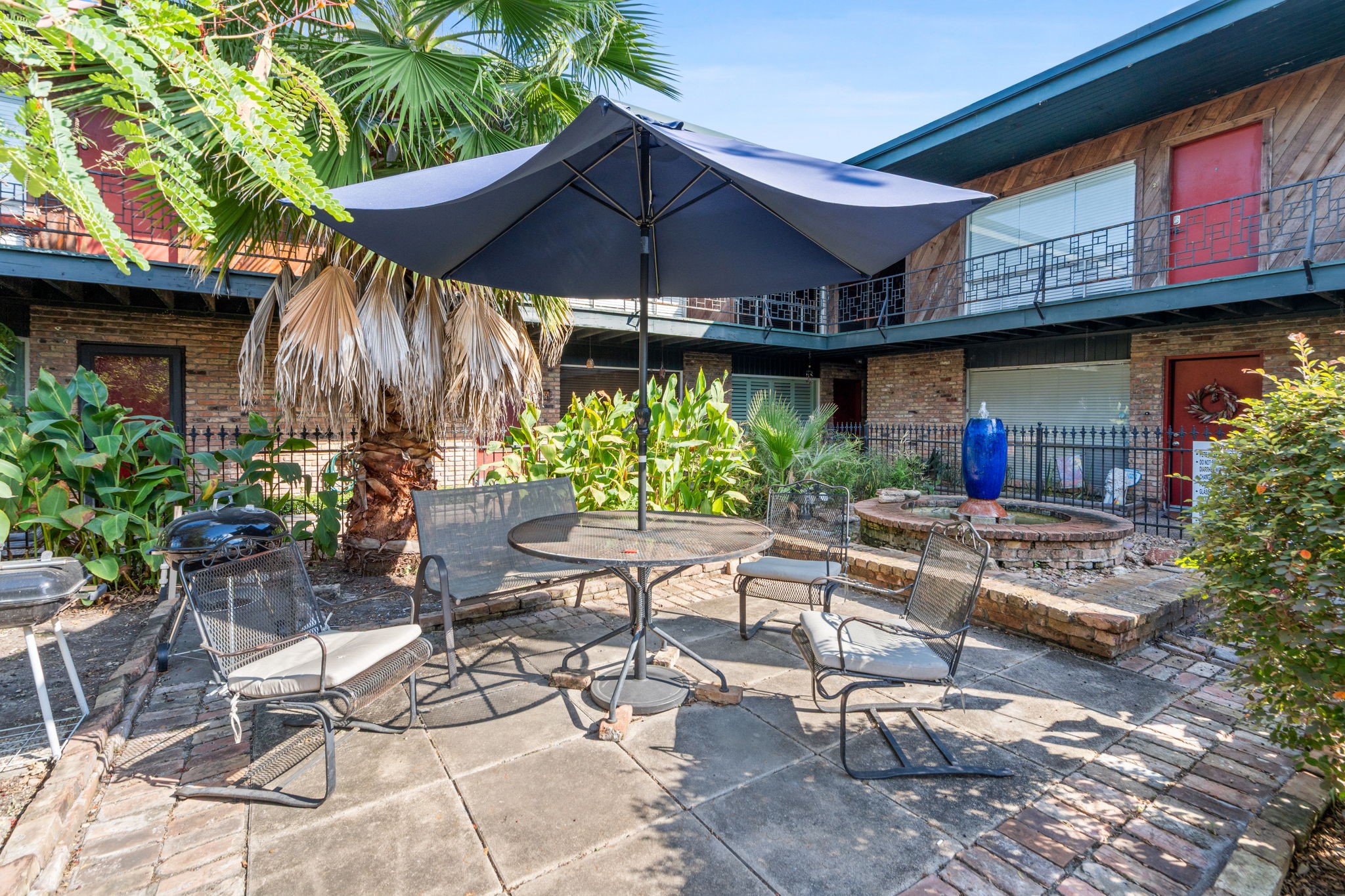 1849 Marshall Street, Unit 9 Houston, TX 77098 - Photo 21 of 25 Sitting Area with Grills and a Peaceful Fountain