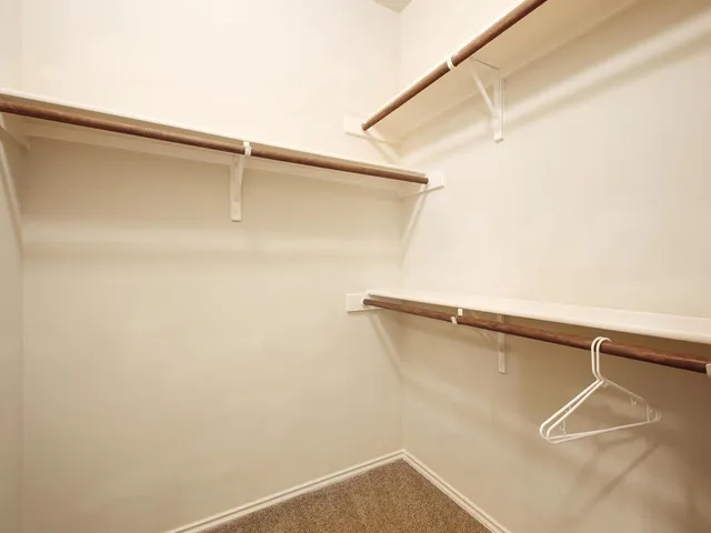 a view of a room with racks on the wall