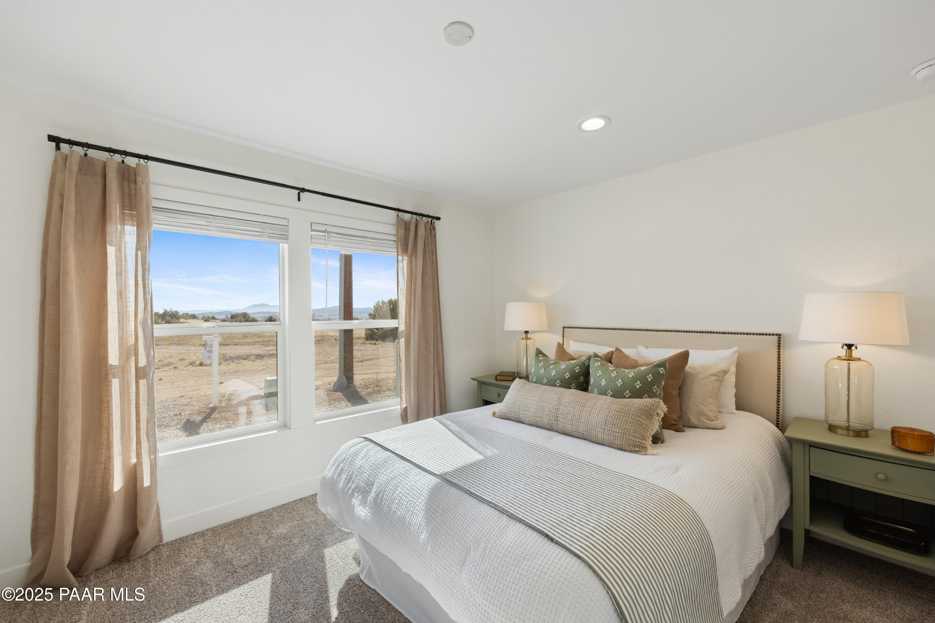 320 East Abra Road Paulden, AZ 86334 - Photo 19 of 28 a bedroom with a large bed and a large window