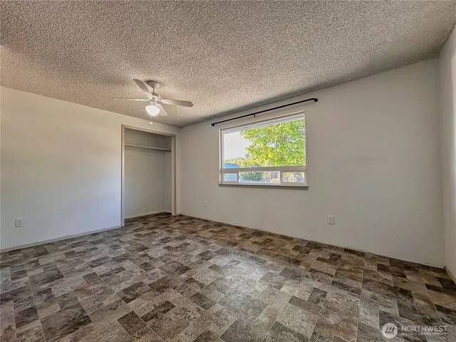 a bathroom with a toilet a sink a mirror a bathtub and shower