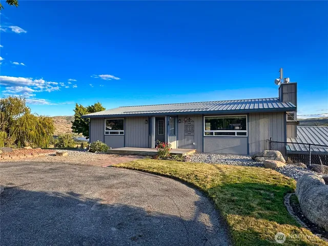 a view of a swimming pool with an outdoor seating