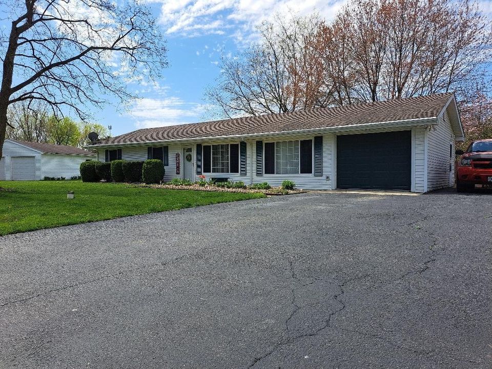 9155 Kings Road Morris, IL 60450 - Photo 2 of 15 a front view of a house with a yard and trees