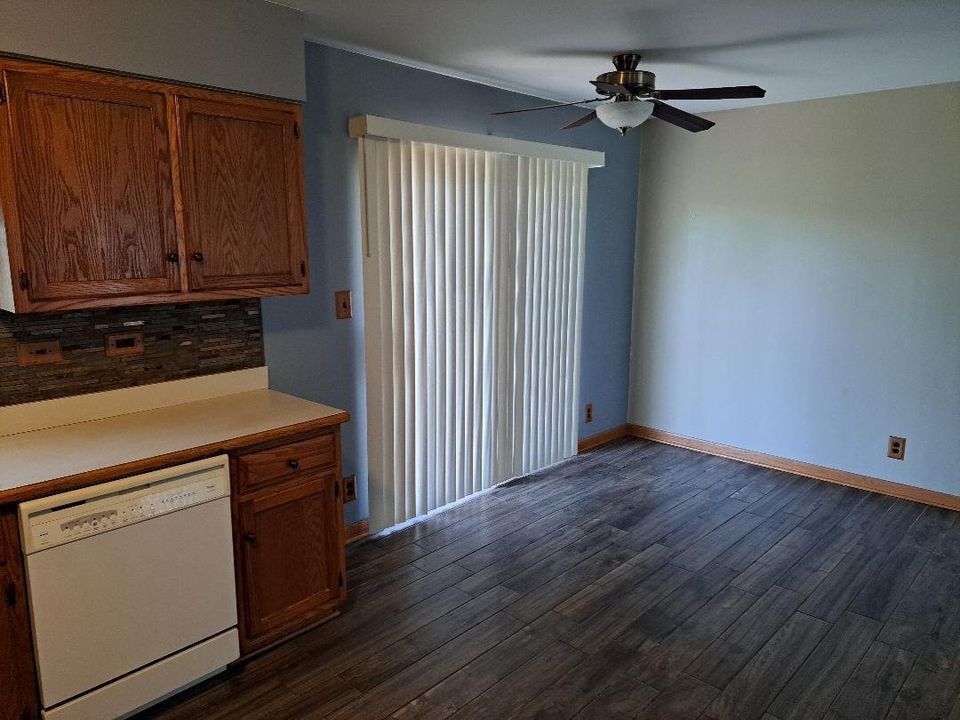 9155 Kings Road Morris, IL 60450 - Photo 9 of 15 an empty room with wooden floor cabinet and window