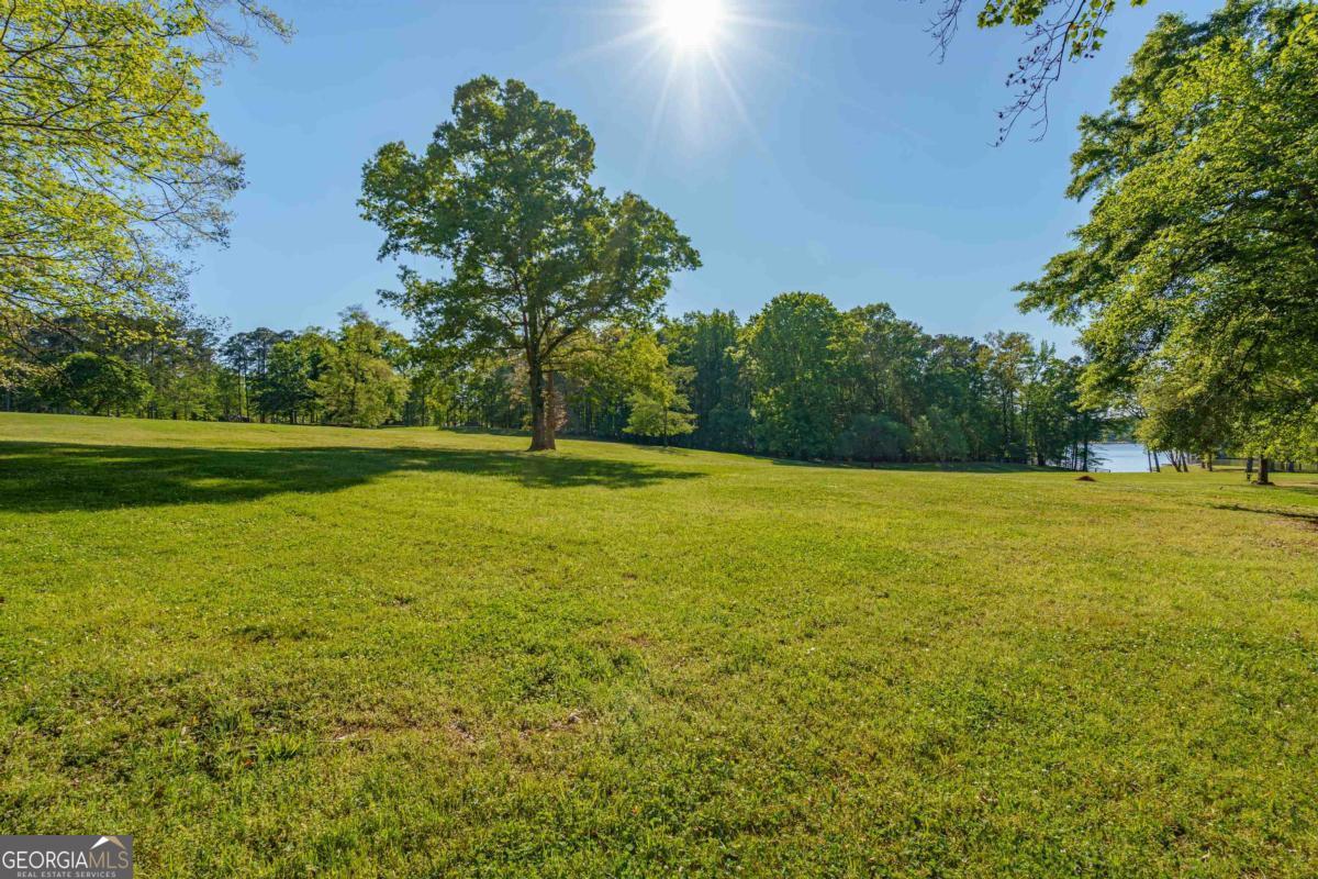1901 Pine Grove Road Greensboro, GA 30642 - Photo 13 of 18 a view of outdoor space with deck and yard