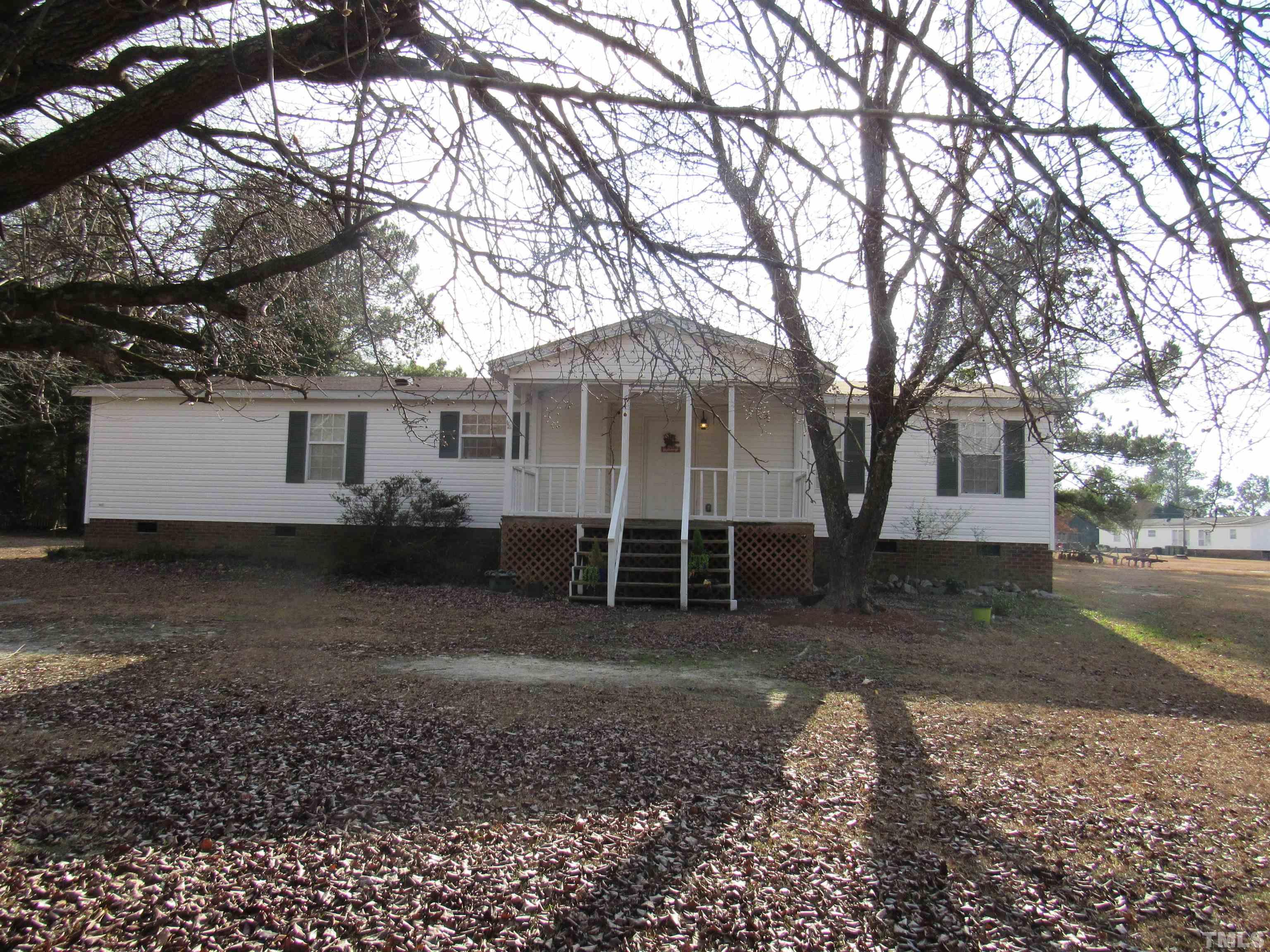 7816 Huff Farm Road Willow Spring, NC 27592 - Photo 2 of 25 a view of a house with a yard