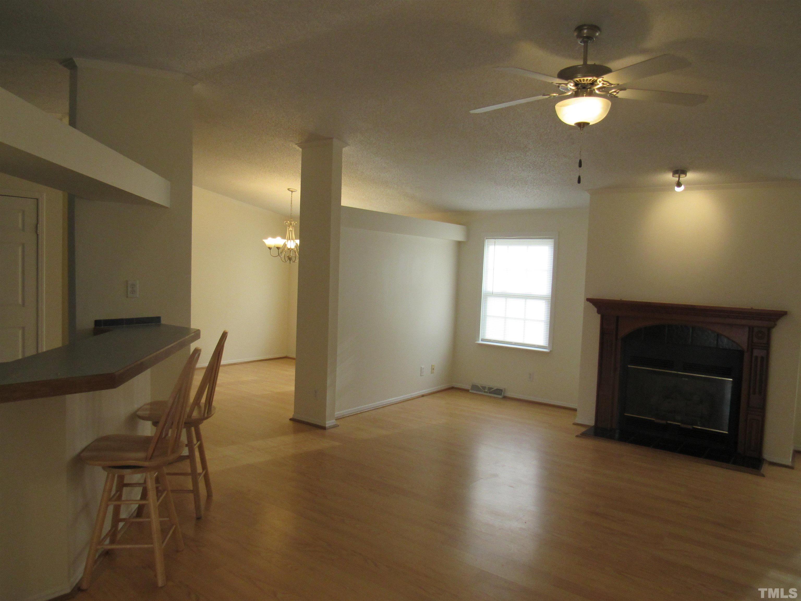 7816 Huff Farm Road Willow Spring, NC 27592 - Photo 11 of 25 a view of a livingroom with furniture and a fireplace