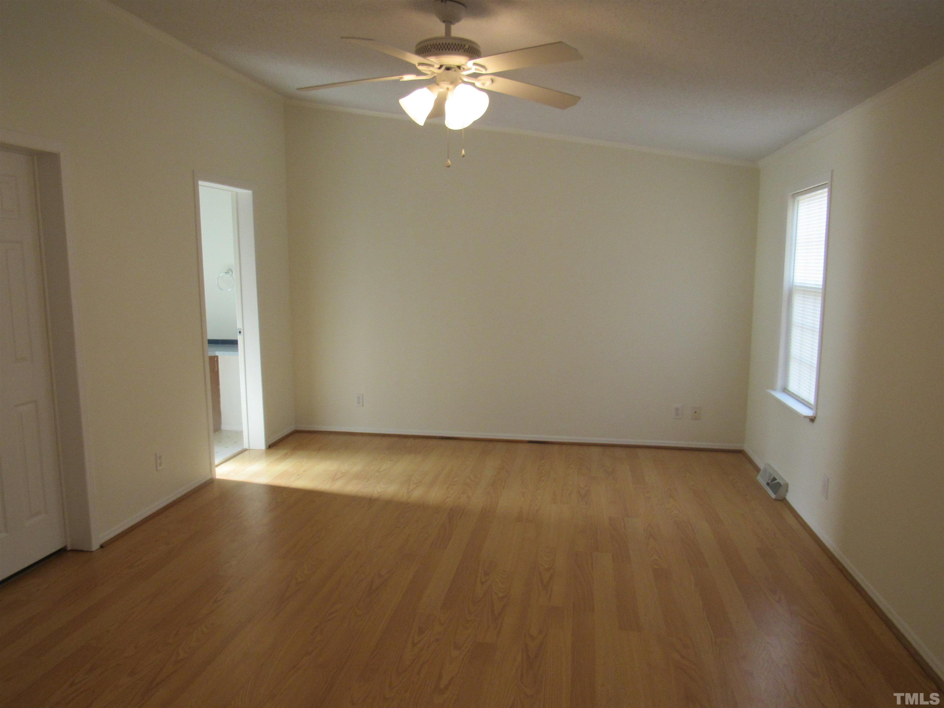 7816 Huff Farm Road Willow Spring, NC 27592 - Photo 12 of 25 an empty room with a empty space and a window