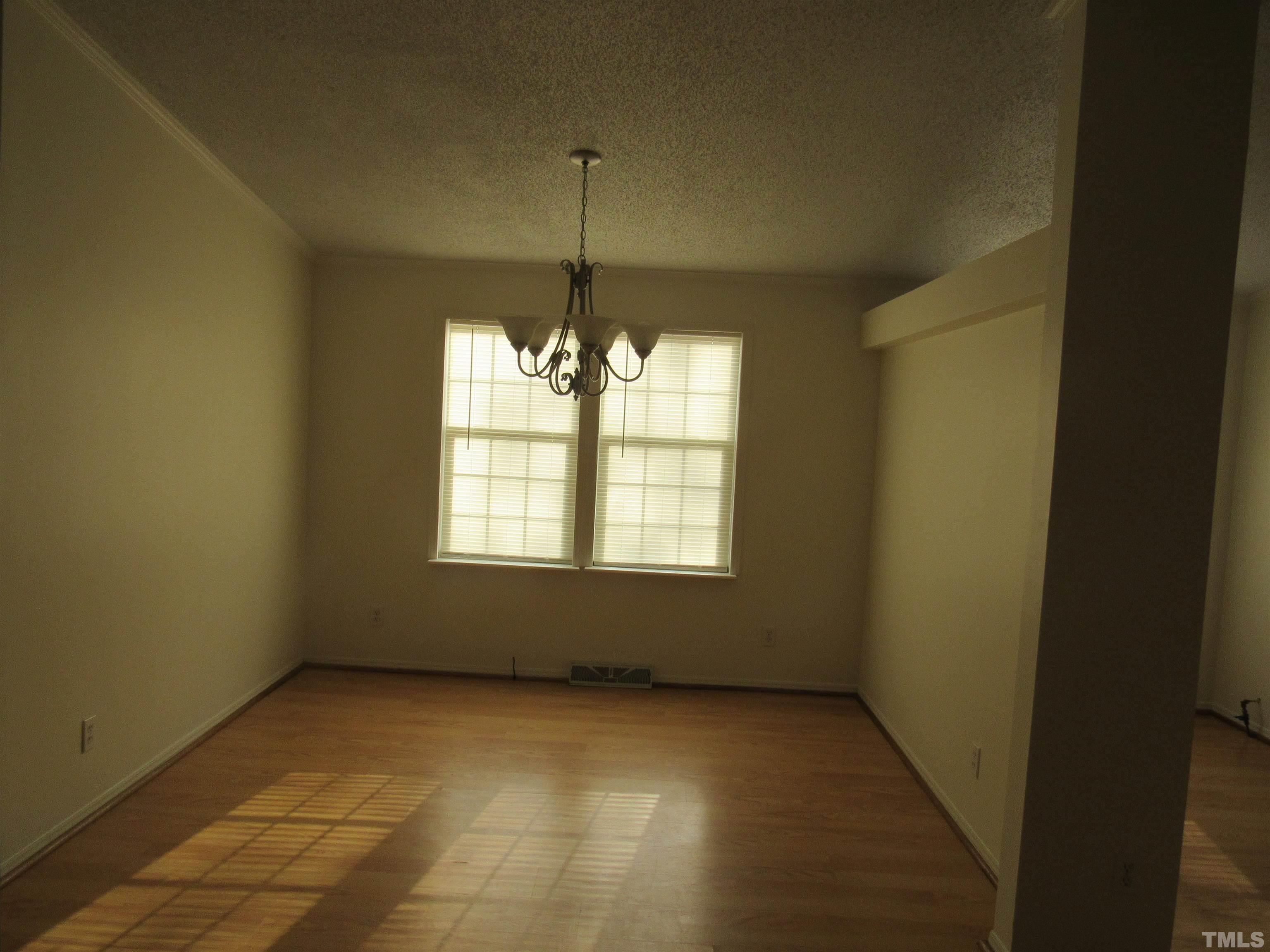 7816 Huff Farm Road Willow Spring, NC 27592 - Photo 15 of 25 a view of an empty room with a window