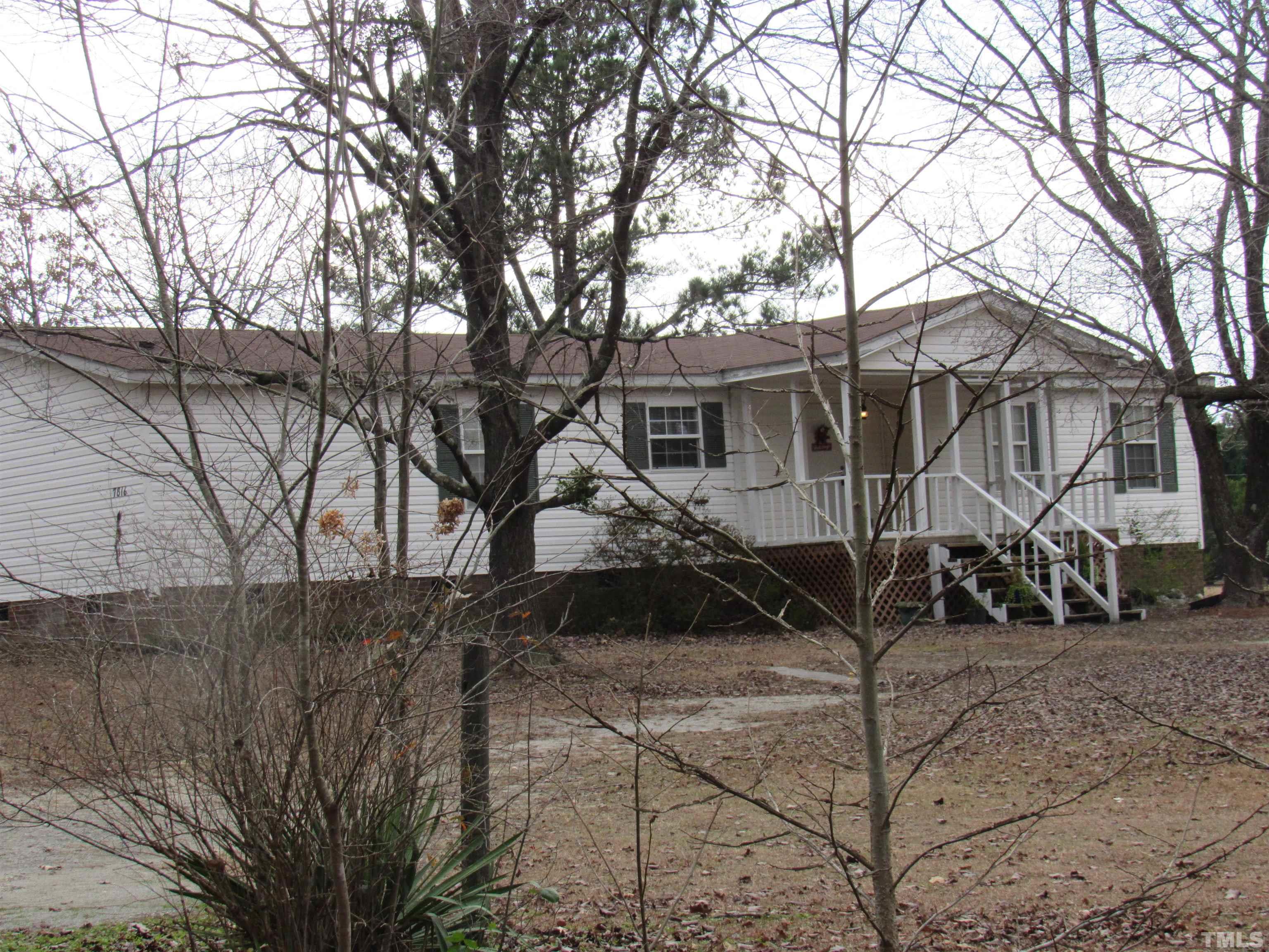 7816 Huff Farm Road Willow Spring, NC 27592 - Photo 22 of 25 a view of a house with a yard