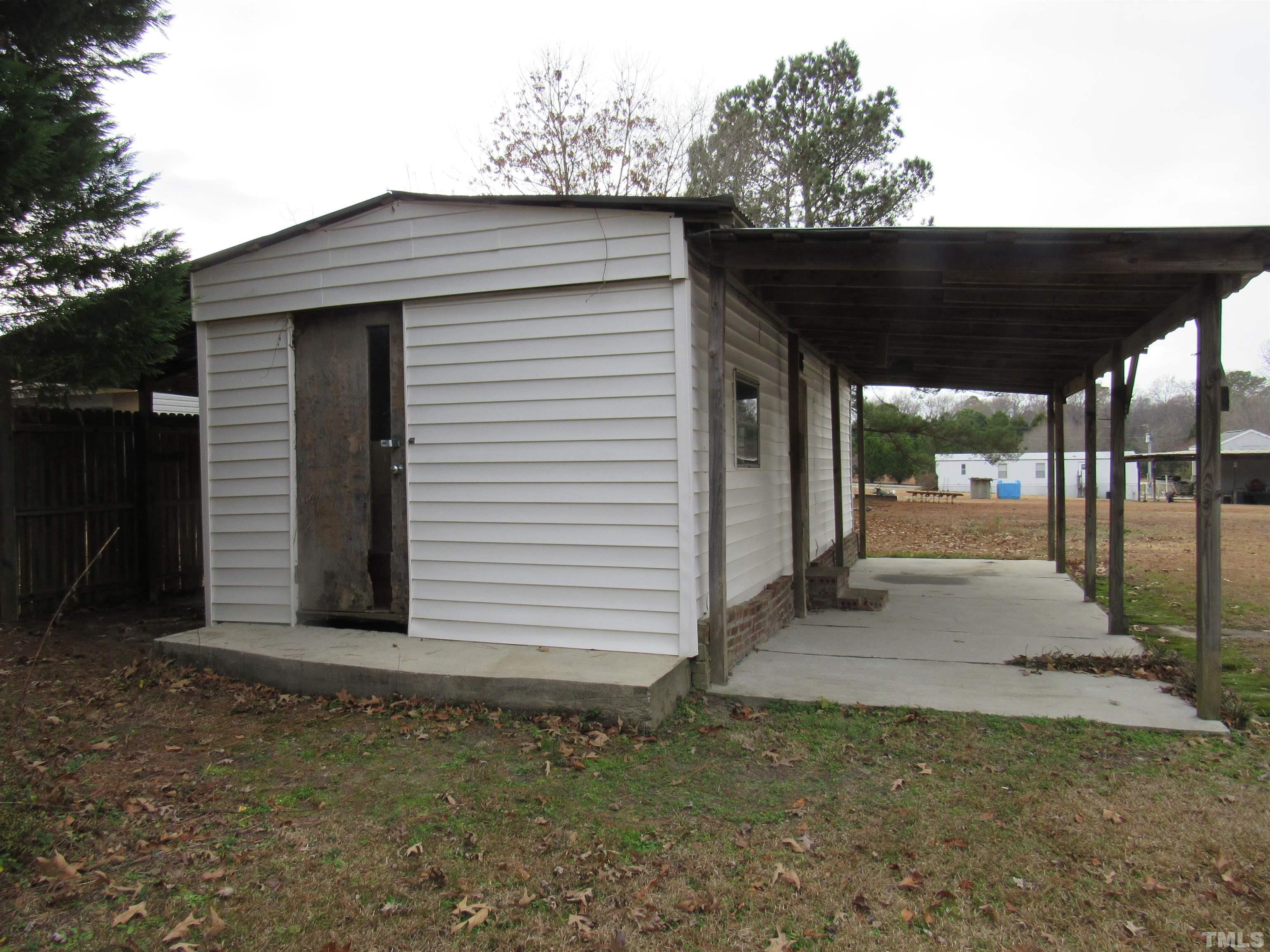 7816 Huff Farm Road Willow Spring, NC 27592 - Photo 24 of 25 a view of a house with a outdoor space