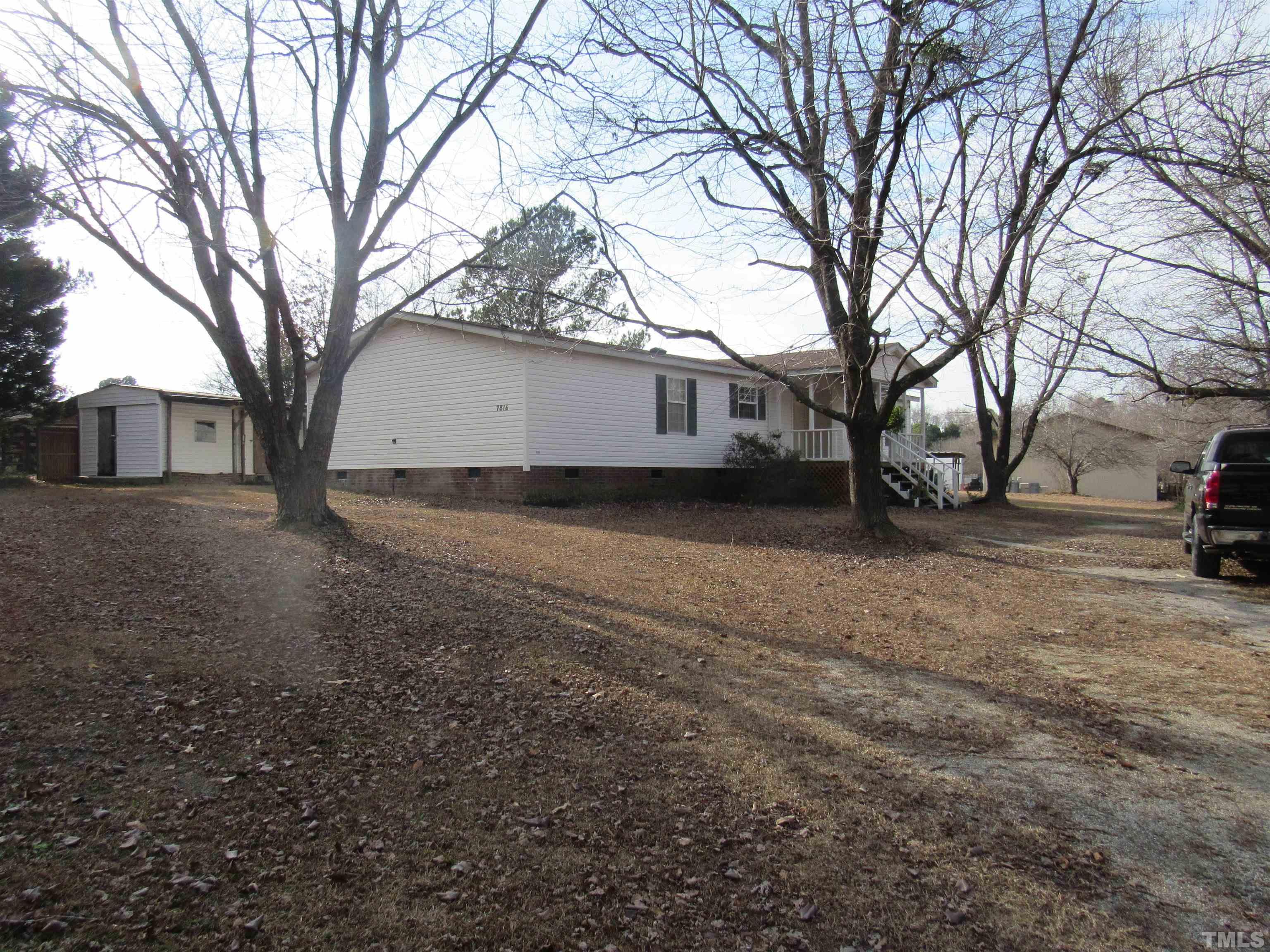 7816 Huff Farm Road Willow Spring, NC 27592 - Photo 4 of 25 a view of a yard with a house