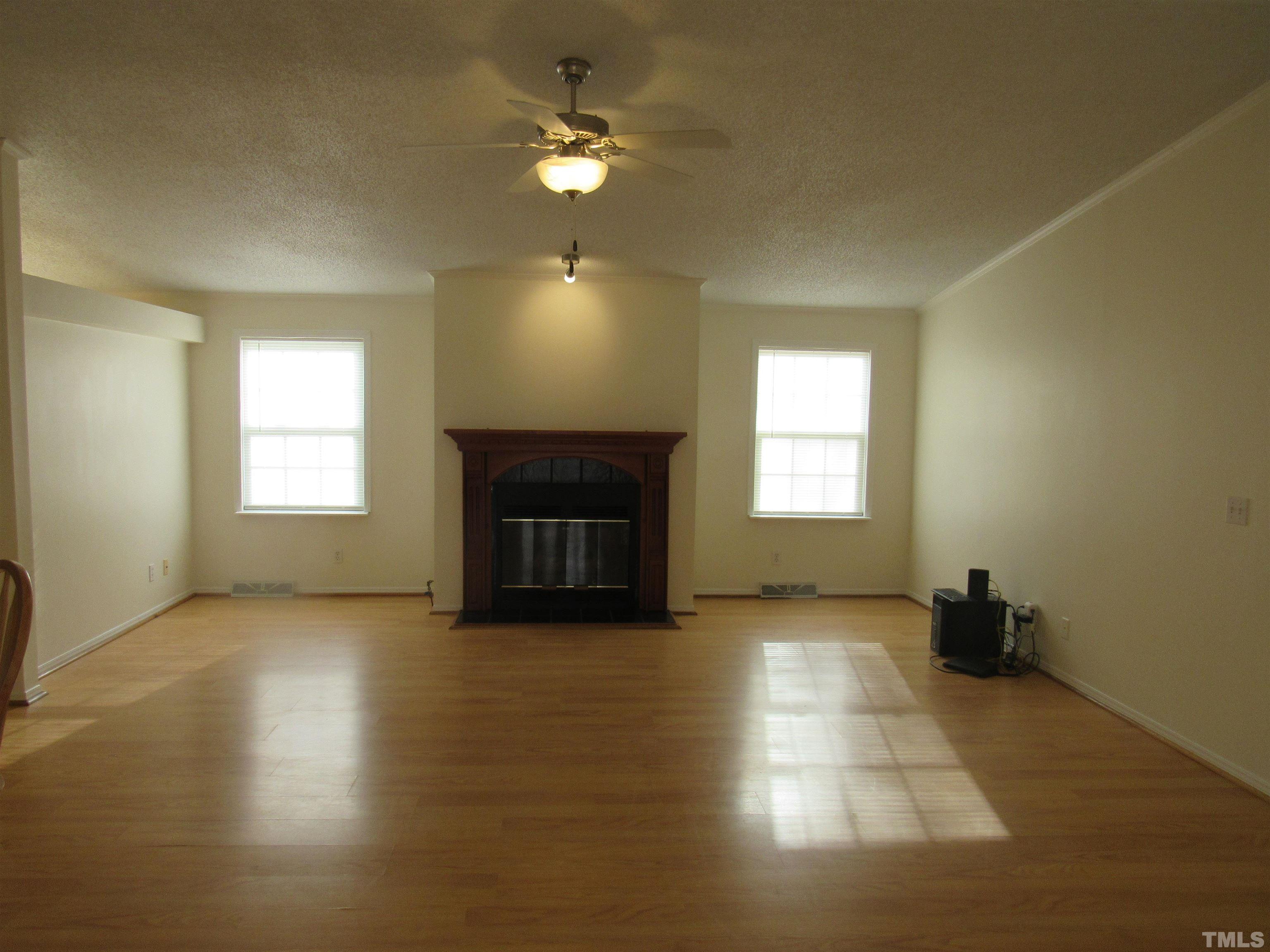 7816 Huff Farm Road Willow Spring, NC 27592 - Photo 10 of 25 a view of empty room with a fireplace