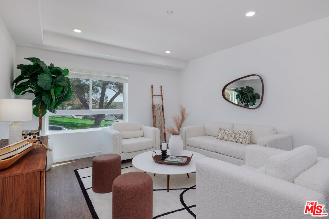 1011 Everett Street, Unit A201 Los Angeles, CA 90026 - Photo 11 of 17 a living room with furniture a window and a table