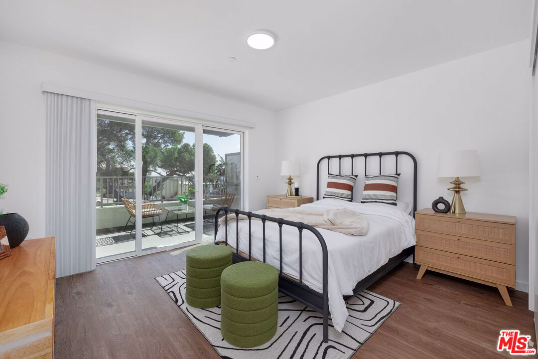 1011 Everett Street, Unit A201 Los Angeles, CA 90026 - Photo 12 of 17 a bedroom with a bed and a large window