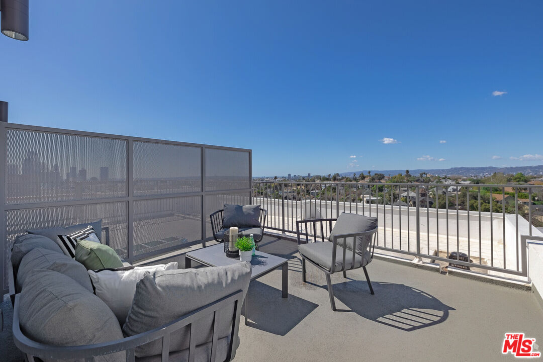 1011 Everett Street, Unit A201 Los Angeles, CA 90026 - Photo 13 of 17 a terrace with a couch and chairs