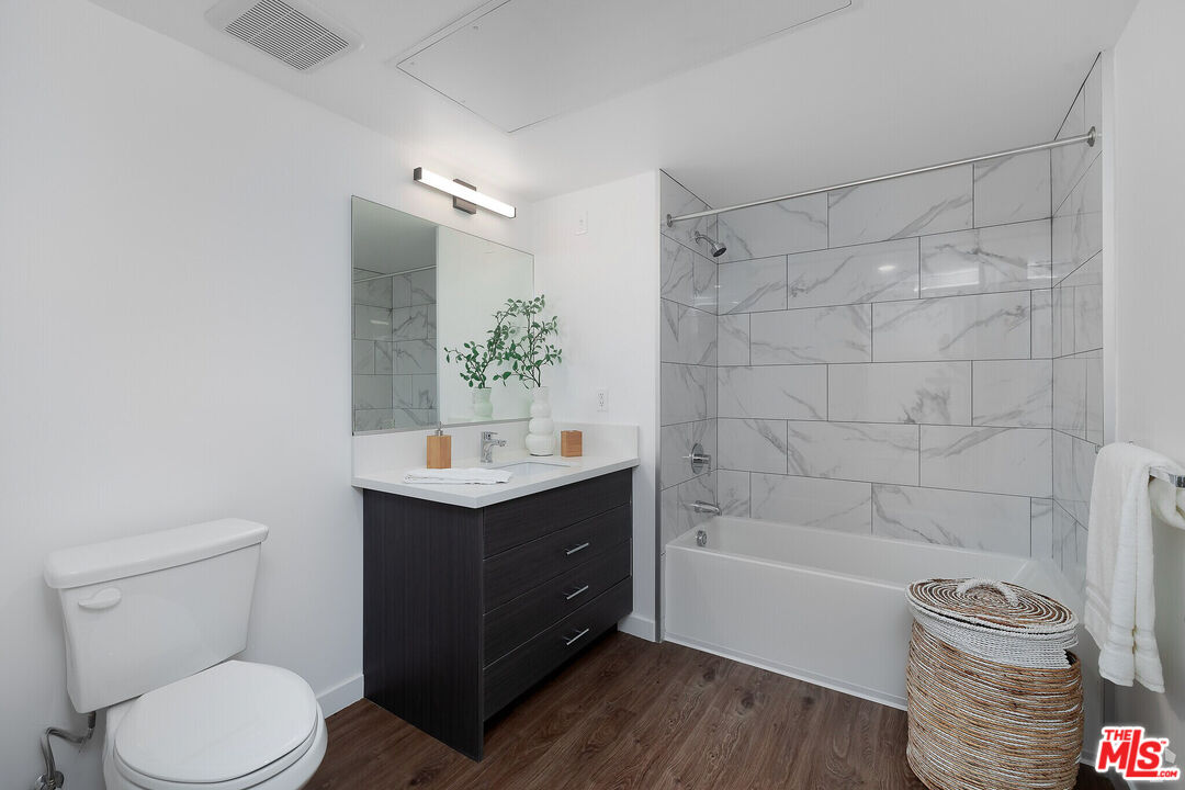 1011 Everett Street, Unit A201 Los Angeles, CA 90026 - Photo 14 of 17 a bathroom with a sink a toilet and shower