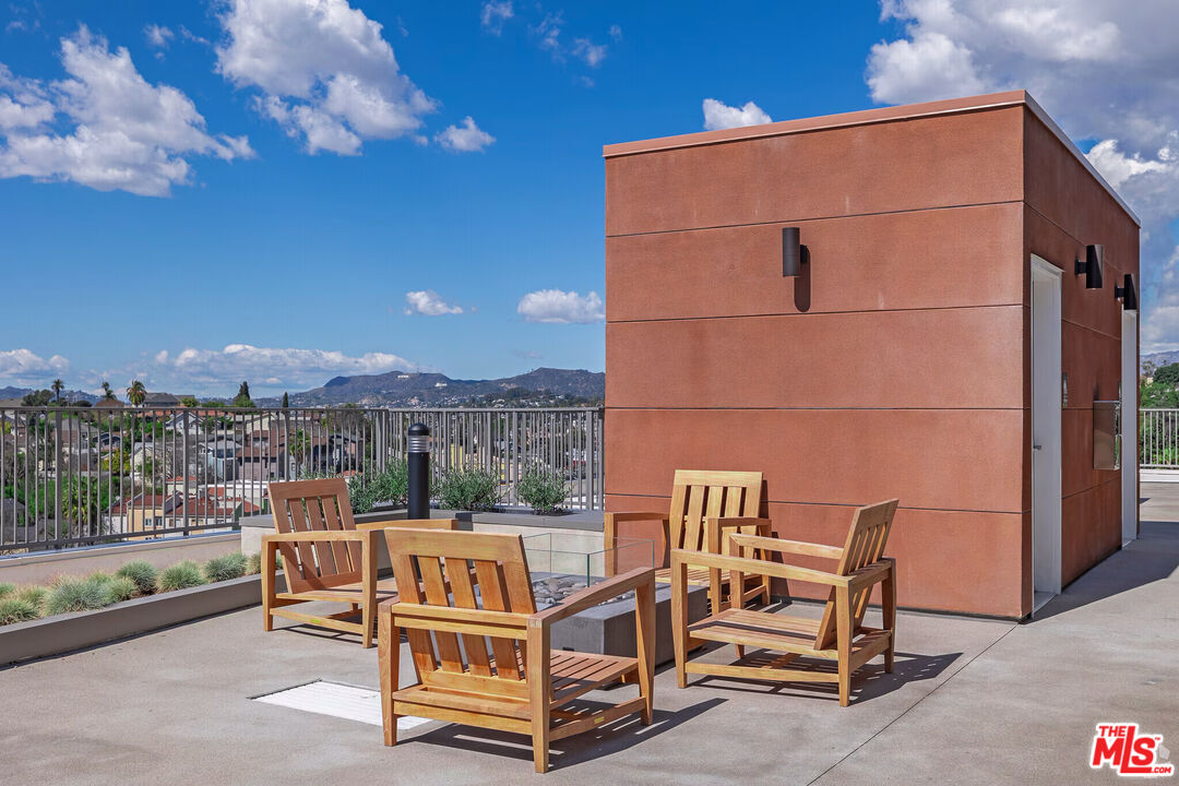 1011 Everett Street, Unit A201 Los Angeles, CA 90026 - Photo 6 of 17 a roof deck with table and chairs