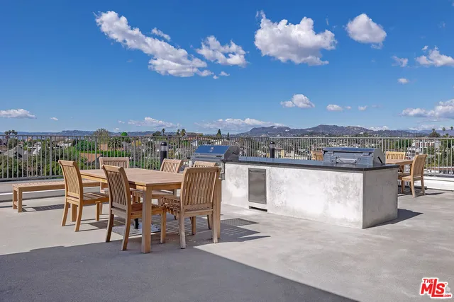 a kitchen with sink cabinets and microwave